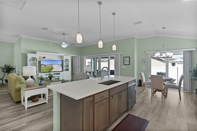 kitchen with a sink, visible vents, dishwasher, and light wood-style flooring