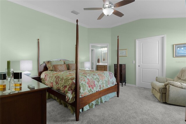 bedroom featuring visible vents, crown molding, light colored carpet, lofted ceiling, and a ceiling fan