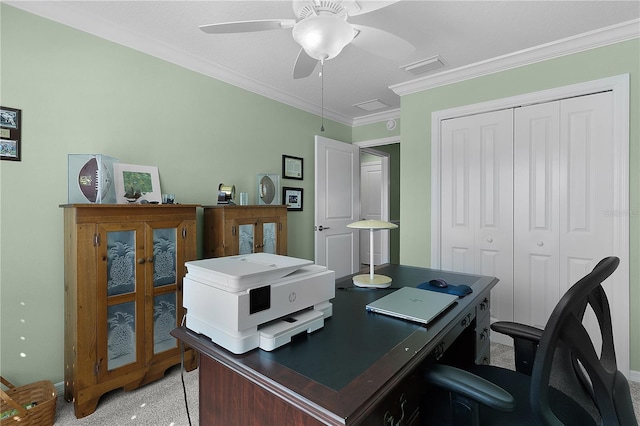 office with visible vents, light colored carpet, ceiling fan, and ornamental molding