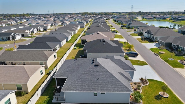 aerial view with a residential view and a water view