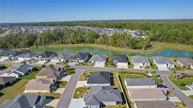 aerial view featuring a residential view and a water view