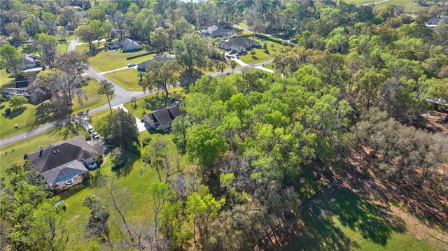 drone / aerial view featuring a view of trees