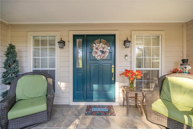 property entrance featuring covered porch