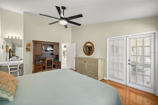 bedroom featuring wood finished floors, ceiling fan, and high vaulted ceiling
