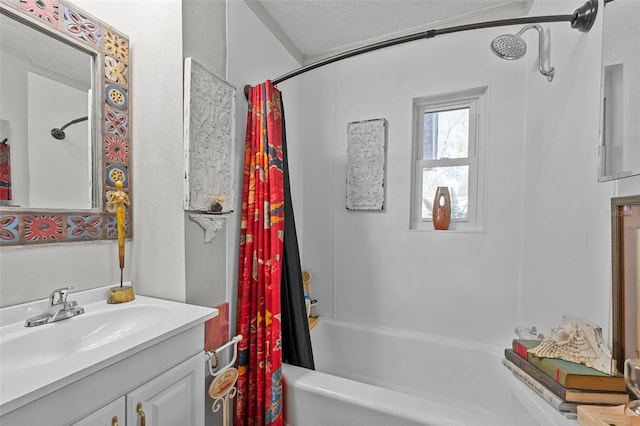 bathroom featuring vanity, shower / bathtub combination with curtain, and a textured ceiling