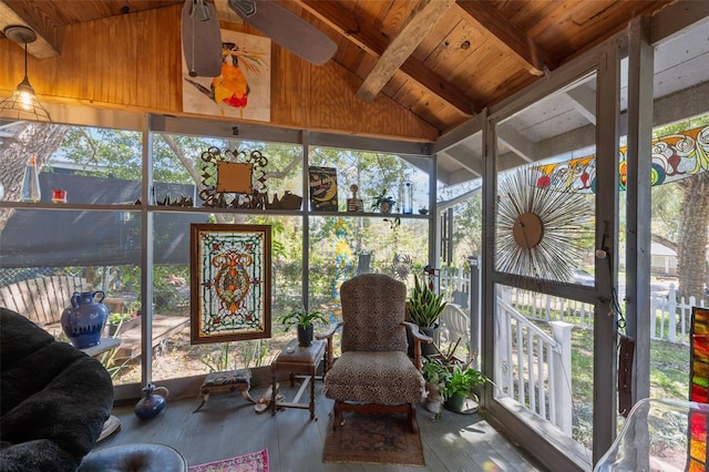 sunroom featuring wooden ceiling, vaulted ceiling with beams, and a ceiling fan