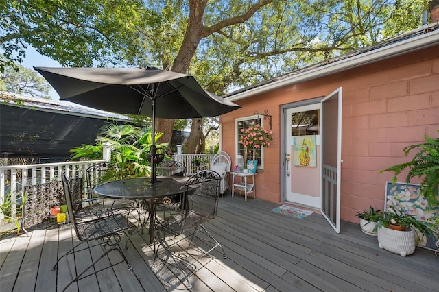 wooden deck with outdoor dining space