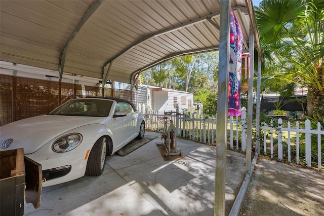 view of car parking featuring fence