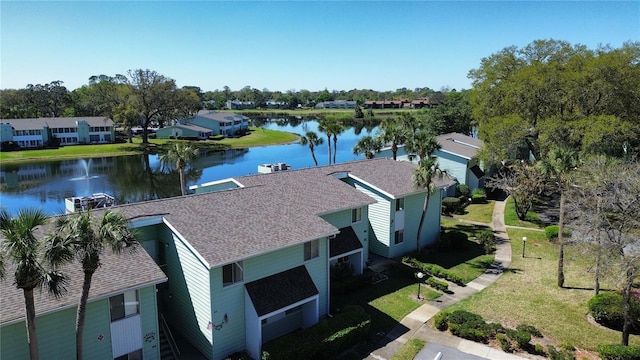 bird's eye view with a residential view and a water view