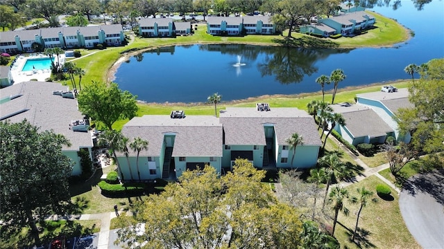 drone / aerial view with a residential view and a water view