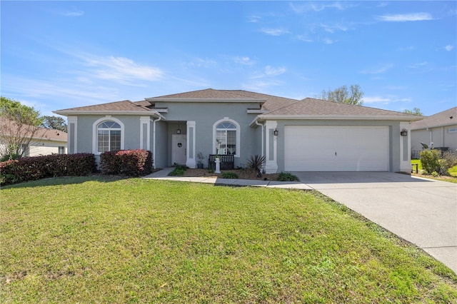 mediterranean / spanish home featuring a front lawn, an attached garage, concrete driveway, and stucco siding