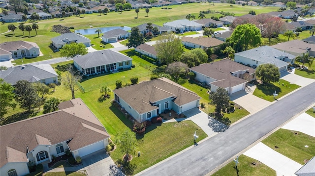 bird's eye view with a residential view and a water view