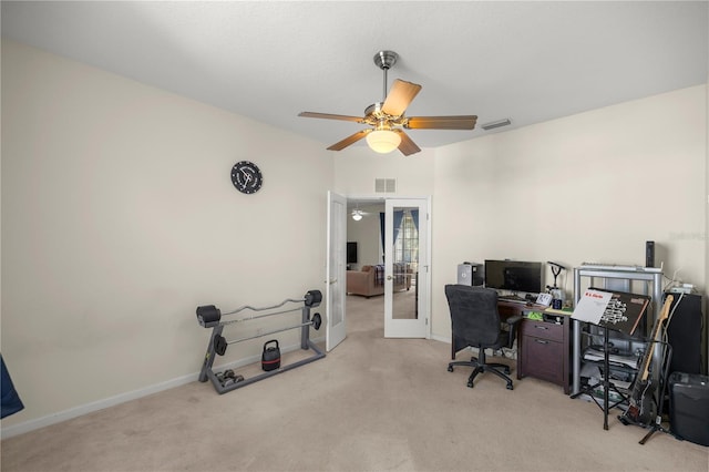 home office with visible vents, light carpet, french doors, baseboards, and ceiling fan