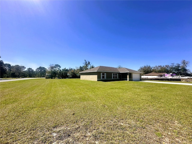 view of yard with a garage