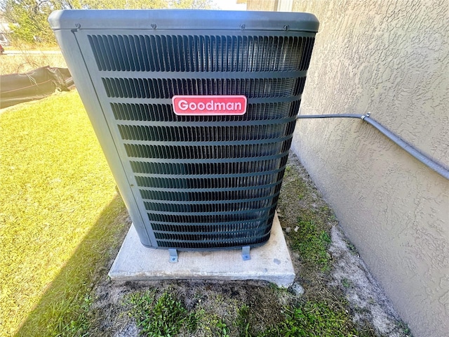 details featuring central air condition unit and stucco siding