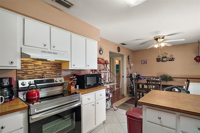 kitchen with visible vents, electric stove, under cabinet range hood, wood counters, and black microwave