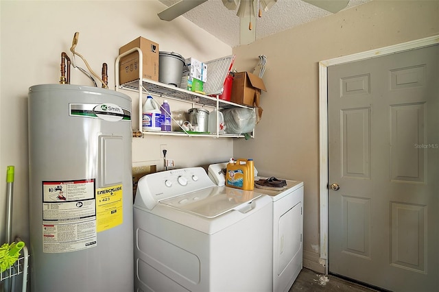 laundry room with a ceiling fan, washer and clothes dryer, a textured ceiling, water heater, and laundry area