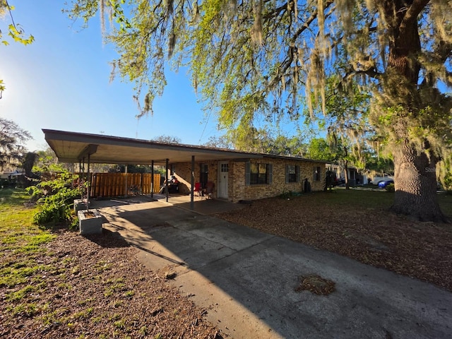 exterior space with a carport and driveway