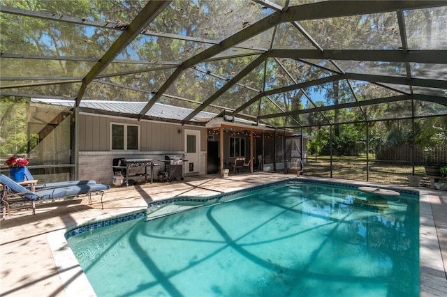 pool featuring a patio and grilling area