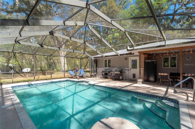 pool featuring a lanai and a patio