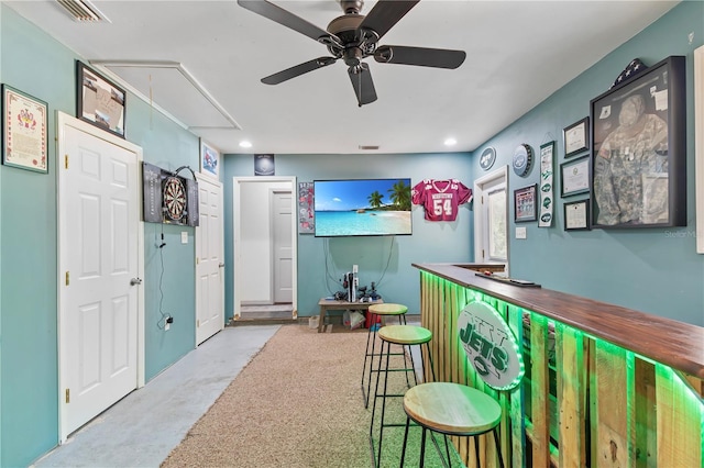 bar featuring visible vents, recessed lighting, a bar, concrete floors, and ceiling fan