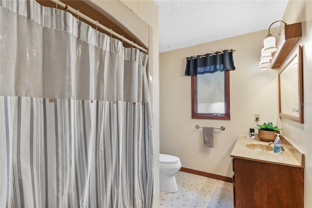 bathroom with vanity, a shower with curtain, baseboards, a textured ceiling, and toilet