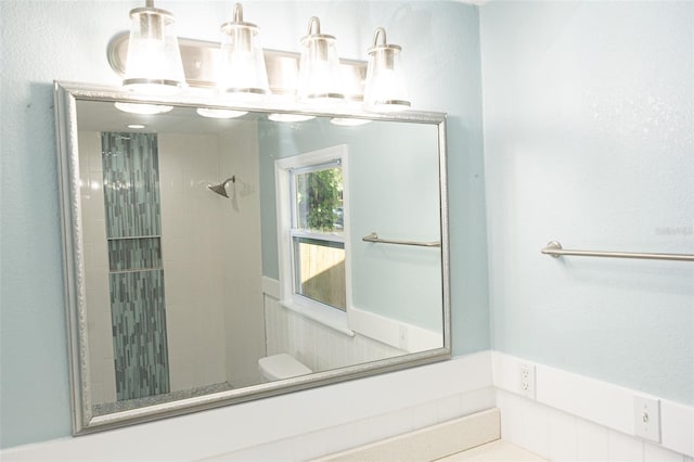 bathroom with a tile shower