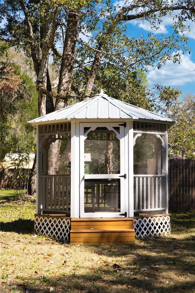 view of outdoor structure with fence