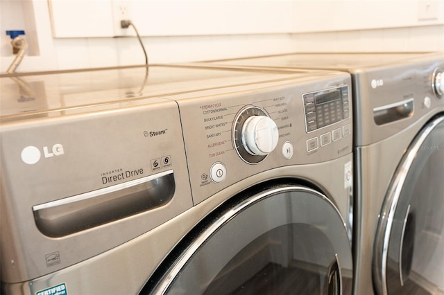 laundry room with washer and dryer and laundry area