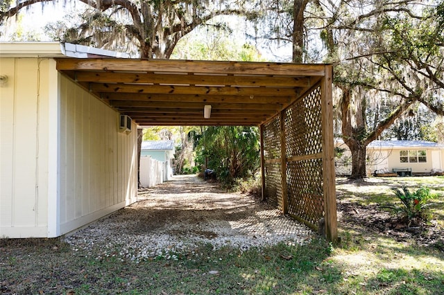 view of vehicle parking featuring an attached carport