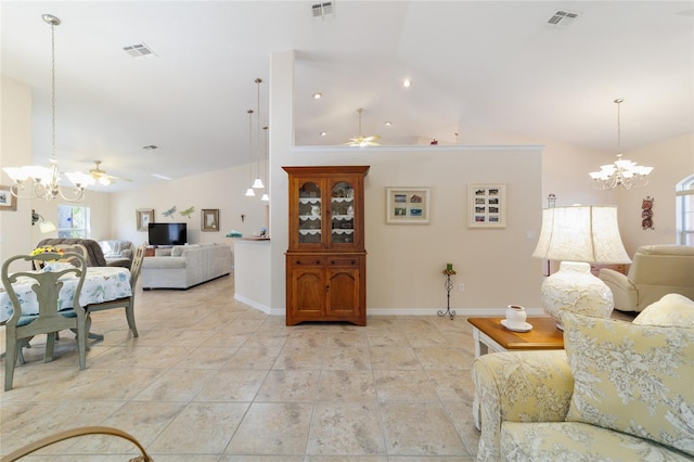 living room with ceiling fan with notable chandelier and visible vents