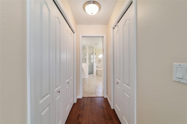 hall with dark wood-style floors