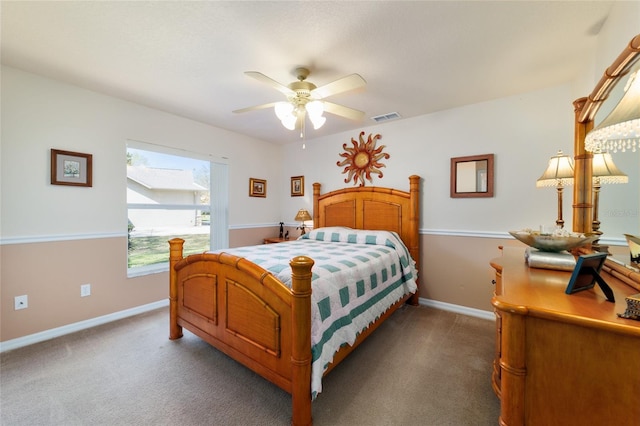 bedroom featuring visible vents, carpet floors, baseboards, and a ceiling fan