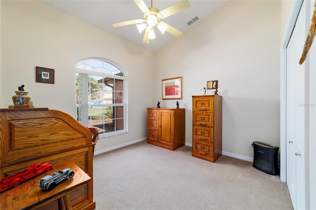 bedroom featuring vaulted ceiling, baseboards, visible vents, and light carpet