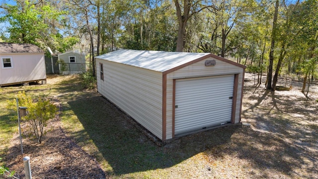 view of shed with fence