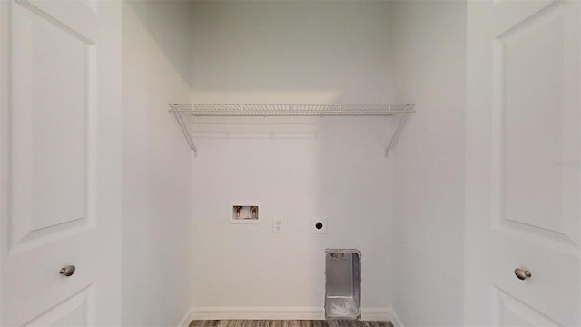 laundry room with baseboards, laundry area, hookup for a washing machine, wood finished floors, and hookup for an electric dryer