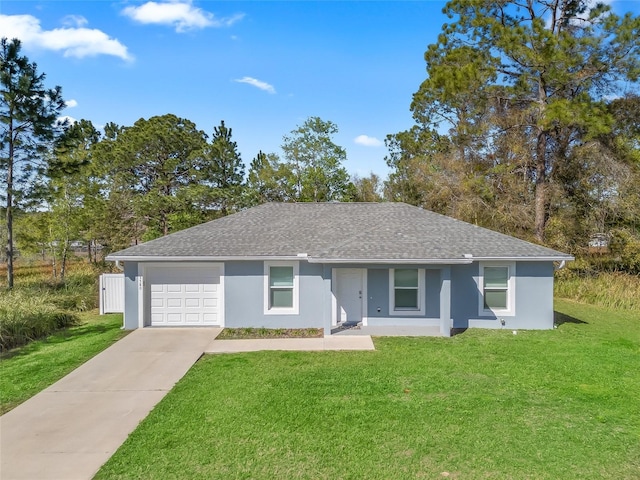 ranch-style house featuring stucco siding, an attached garage, driveway, and a front yard