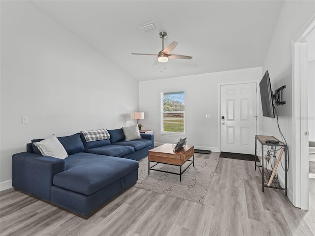 living area with wood finished floors, baseboards, visible vents, lofted ceiling, and ceiling fan