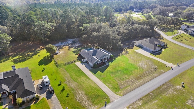 aerial view featuring a wooded view