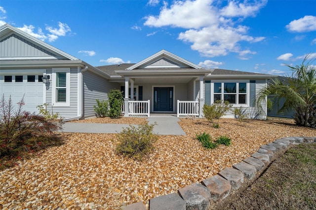 ranch-style home with a garage and covered porch