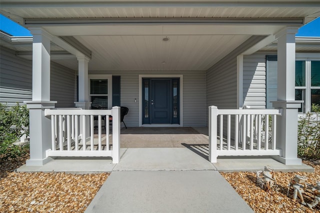 entrance to property with covered porch