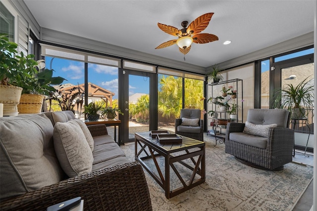 sunroom / solarium with plenty of natural light and a ceiling fan