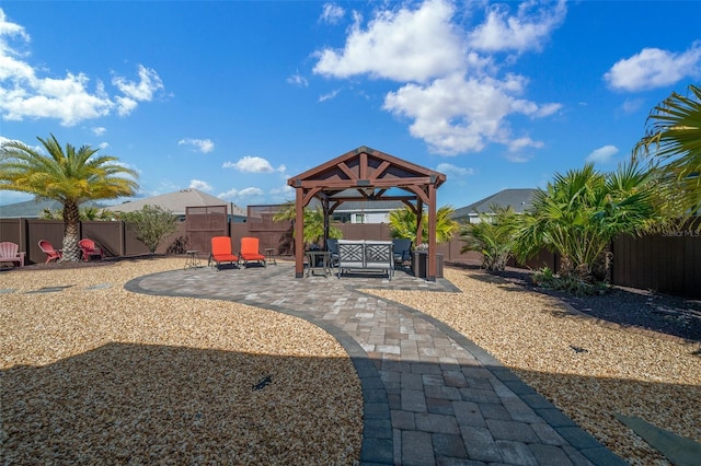 view of yard with a patio area, a gazebo, and a fenced backyard