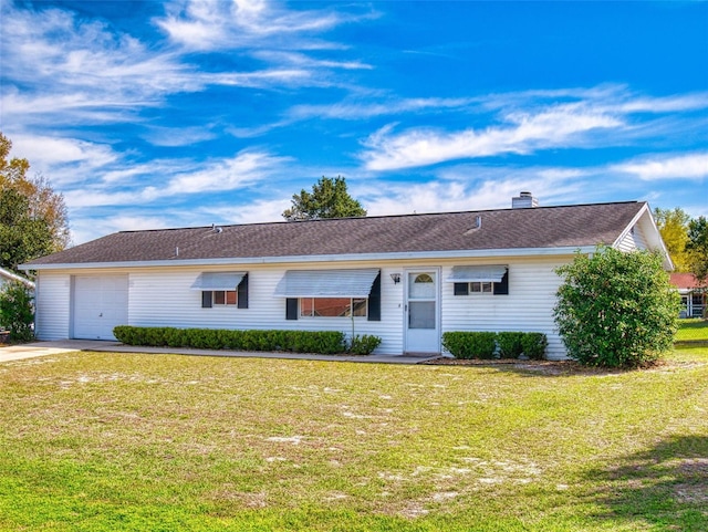 ranch-style home with a chimney, an attached garage, concrete driveway, and a front lawn