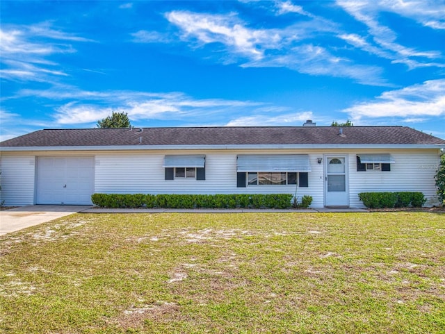 single story home featuring an attached garage, concrete driveway, and a front yard