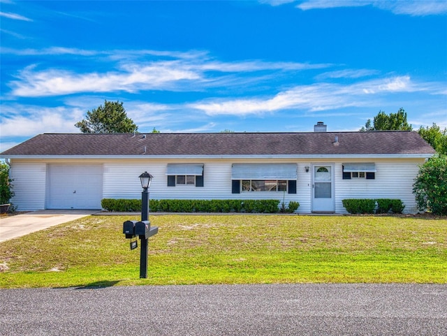 single story home with a chimney, driveway, an attached garage, and a front lawn