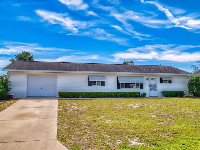 ranch-style house with driveway, an attached garage, and a front yard