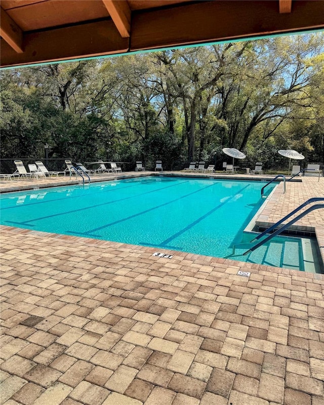 pool featuring a patio area