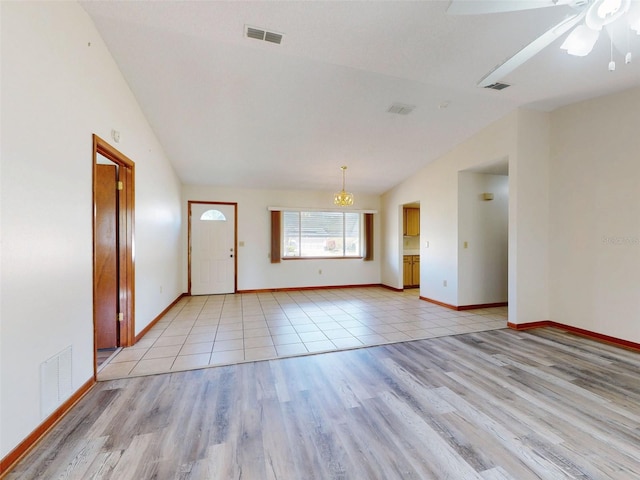 11197 SW 79th Ave, Ocala, FL 34476 - entrance foyer featuring lofted ceiling, light wood-style floors, baseboards, and a ceiling fan