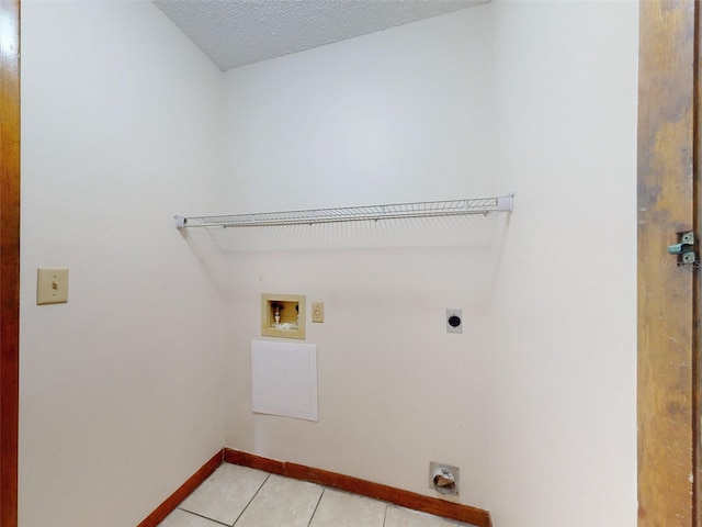 11197 SW 79th Ave, Ocala, FL 34476 - washroom featuring hookup for an electric dryer, hookup for a washing machine, light tile patterned floors, and baseboards